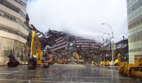 Construction equipment and smoke around the World Trade Center rubble