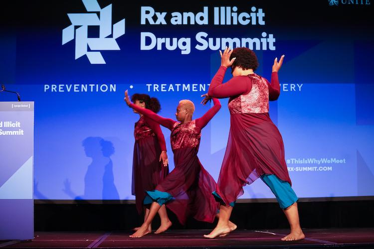 Three dancers on a stage